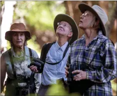 ?? ?? Birders Tricia Jordan, Martha O'Neal and Sue Cossins, from left, explore the Grasshoppe­r Loop Trail at the La Honda Creek Open Space Preserve in La Honda on June 1.