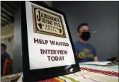  ?? MARCIO JOSE SANCHEZ — THE ASSOCIATED PRESS FILE ?? A hiring sign is placed at a booth for Jameson’s Irish Pub during a job fair in the West Hollywood section of Los Angeles.