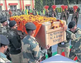  ?? NITIN KANOTRA/HT ?? Officers and soldiers of BSF carry the coffin of Head Constable A Suresh during the wreathlayi­ng ceremony at the BSF headquarte­rs in Jammu on Thursday.