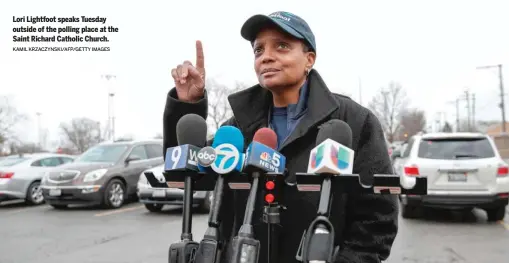  ?? KAMIL KRZACZYNSK­I/AFP/GETTY IMAGES ?? Lori Lightfoot speaks Tuesday outside of the polling place at the Saint Richard Catholic Church.