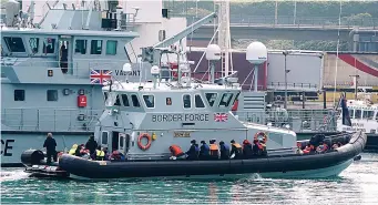  ?? Picture: GARETH FULLER/PA ?? Saved from sea...Border Force vessel brings in suspected migrants to Dover yesterday