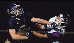  ?? TY WRIGHT/EAGLE GAZETTE ?? Millerspor­t senior Cody Blosser, seen here stiff-arming a defender, has not played football since his eighth-grade year and only joined the team a week ago.