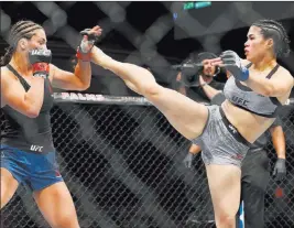  ?? Erik Verduzco ?? Las Vegas Review-journal Rachael Ostovich, delivering a kick to Montana De La Rosa during a UFC women’s flyweight bout on July 6, was hospitaliz­ed over the weekend after an attack in her hometown of Honolulu left her with a broken orbital bone and other injuries.