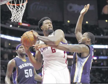  ?? ASSOCIATED PRESS FILES ?? Center DeAndre Jordan, grabbing a rebound in front of Grizzlies Zach Randolph (left) and JaMychal Green, reportedly has chosen to join the Dallas Mavericks instead of returning to the Los Angeles Clippers. The Mavs also added guard Wes Matthews from...