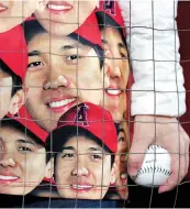  ?? ?? A fan wears clothing with pictures of Shohei Ohtani.