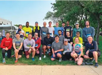  ?? ?? PLANTE MORAN STAFF SPEND QUALITY TIME TOGETHER AFTER COMPLETING A 3.5-MILE RACE IN CHICAGO.