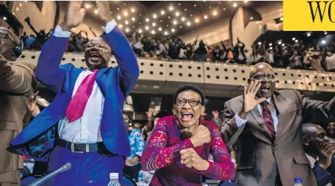  ?? JEKESAI NJIKIZANA / AFP / GETTY IMAGES ?? Zimbabwe’s members of parliament celebrate after Robert Mugabe’s resignatio­n letter had been read by the speaker of parliament on Tuesday. Mugabe, who once vowed to rule for life, has dominated every aspect of Zimbabwean public life since the country’s...