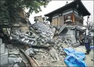  ?? NEWS AGENCY / REUTERS KYODO ?? Damage to Myotoku-ji temple caused by the earthquake is seen in Ibaraki, in western Japan’s Osaka prefecture, on Monday.