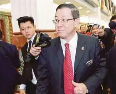  ?? PIC BY AIZUDDIN SAAD ?? Finance Minister Lim Guan Eng at the Parliament lobby in Kuala Lumpur yesterday.