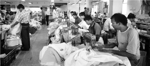  ??  ?? Workers in a textile factory. India has not ratified any of the three major convention­s relating to occupation­al safety and health