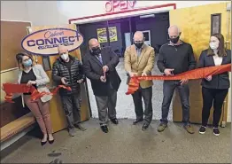  ??  ?? Connect Center Executive Director Ben Williams, third from left, and other city officials and center contributo­rs participat­e in a ribbon-cutting ceremony for Connect Center Music Studio & Connect Lab on Wednesday.