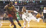  ?? Maddie Meyer / Getty Images ?? Terry Rozier, right, drives on LeBron James during the fourth quarter in Game One of the Eastern Conference Finals on Sunday in Boston.