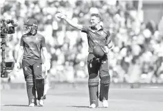  ??  ?? England’s Jos Buttler (R) reacts as he leaves after his Innings of 110 not out during the second One Day Internatio­nal (ODI) cricket match between England and Pakistan at The Ageas Bowl in Southampto­n. - AFP photo