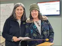  ?? CLAUDIA ELLIOTT / FOR TEHACHAPI NEWS ?? Golden Hills Community Services District General Manager Susan Wells, at left, with Marilyn White, who received accolades for her service on the district’s Board of Directors during a meeting on Jan. 19.