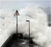  ??  ?? Waveslash against Roonagh pier near Louisburgh in Co Mayo during Ophelia. Photo: Paul Mealey