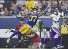  ?? The Associated Press ?? Los Angeles Rams defensive back Sam Shields (37) breaks up a pass intended for Minnesota Vikings receiver Stefon Diggs during first-half NFL action on Thursday night in Los Angeles. The Rams won 38-31.