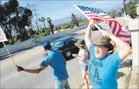  ?? Christina House
For The Times ?? EZRA HORN, right, and others rally for pedestrian and bicycle paths in a revamped Glendale Boulevard-Hyperion Avenue bridge.