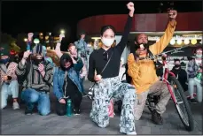  ??  ?? Protesters kneel and raise their fists as they listen to speeches during a rally for the late George Floyd outside Barclays Center on Oct 14, 2020, in New York. Demonstrat­ors gathered on what would have been Floyd’s 47th birthday to call for action in correcting systemic racism in policing and for criminal justice
reform. (AP)