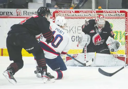  ?? BRANDON HARDER ?? Regina’s Austin Pratt takes a shot on Moose Jaw Warriors goaltender Adam Evanoff during the Pat’s 5-O win on Dec. 28 at the Brandt Centre.