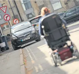  ?? ?? Edinburgh will be the first council to ban cars parking on pavements.