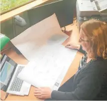  ??  ?? Katikati Innovative Horticultu­re Project manager Hilary Johnson looks over the plans of the new facility to be built at Katikati College.