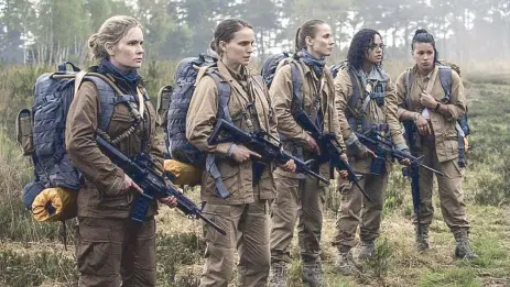  ??  ?? Locked and loaded: Jennifer Jason Leigh (left) and Natalie Portman lead a team of female scientists into Area X in Alex Garland’s Netflix-premiering Annihilati­on.