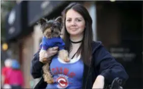  ?? ASSOCIATED PRESS ?? Lauren Pestikas holds her dog Sambuca in Chicago. Since starting treatments with ketamine infusions, she says she feels much better for a few weeks after each session. Her monthly infusions last about 45 minutes and cost $550 each.