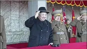  ?? KRT VIA AP VIDEO ?? North Korean leader Kim Jong Un (center) attends Thursday’s military parade in Pyongyang. Virtually all foreign media were excluded from the event.