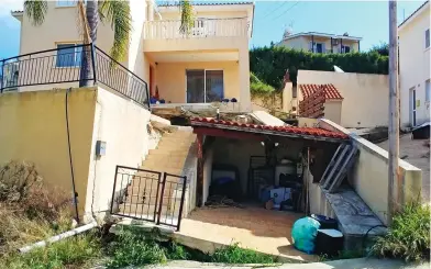  ??  ?? Tipping point: The crumbling villa in Armou, with its garage now at a 12-degree angle