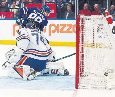  ?? STEVE RUSSELL TORONTO STAR ?? Leafs winger William Nylander scores on Oilers goalie Stuart Skinner, who was chased from the net after allowing five goals.