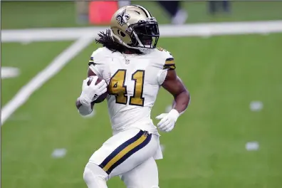  ?? The Associated Press ?? RECORD-SETTING DAY: New Orleans Saints running back Alvin Kamara (41) breaks free on a 40 yard touchdown carry in the first half of Friday’s game against the Minnesota Vikings in New Orleans.