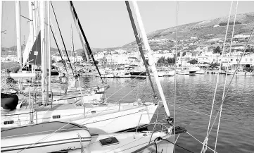  ??  ?? Attesting to its popularity, the Naoussa boat slip on the island of Paros is crowded, as the solitude of the open sea beckons.