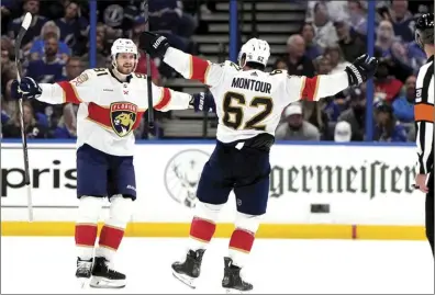  ?? AP photo ?? Florida defenseman Brandon Montour (62) celebrates his goal against Tampa Bay with defenseman Oliver Ekman-Larsson (91) during the second period of Game 3 of the Stanley Cup first-round playoff series on Thursday in Tampa, Fla.