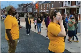  ?? EVAN BRANDT — MEDIANEWS GROUP ?? Emanuel Wilkerson and Alana Hook from the Pottstown chapter of the NAACP lead the anti-hate rally in a chant Wednesday night.
