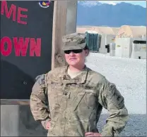  ?? Courtesy photos ?? (Above left) 1st Armored Division patch. (Above) Jennifer McCoy at Bagram. (Right) Jennifer with Tony Rodriguez. (Left) Army Commendati­on Medal.