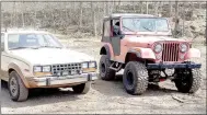  ?? Photo courtesy of Justin Brunje ?? Justin Brunje’s eagle takes a break from rolling down trails alongside another off-roader’s Jeep.