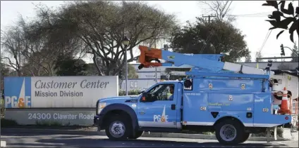  ?? AP PHOTO/BEN MARGOT ?? In this Jan. 23 file photo, a Pacific Gas & Electric repair truck enters their customer center in Hayward, Calif.