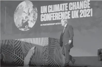  ?? ERIN SCHAFF / AP ?? British Prime Minister Boris Johnson walks out to speak during a session on Action on Forests and Land Use during the UN Climate Change Conference COP26 on Nov. 2 in Glasgow, Scotland.