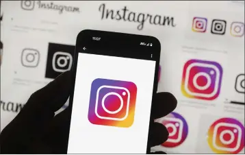  ?? MICHAEL DWYER — THE ASSOCIATED PRESS FILE ?? The Instagram logo is seen on a phone in Boston on Oct. 14, 2022.
