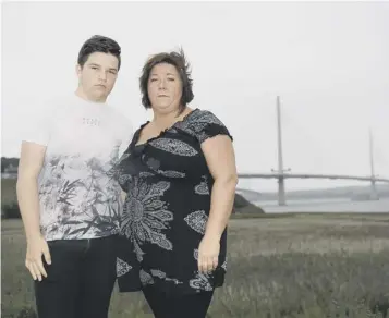  ??  ?? Catherine Mccolm and son Jake will remember a husband and father as they walk the bridge