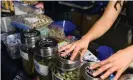  ??  ?? Bags of psilocybin mushrooms, left, are seen displayed at a pop-up cannabis market in Los Angeles on 6 May 2019. Photograph: Richard Vogel/AP