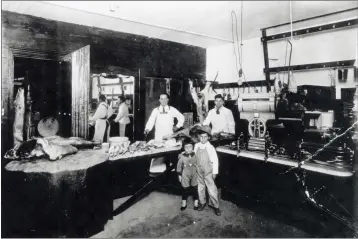  ?? CONTRIBUTE­D ?? The interior of Quaill’s City Meat Market on Main Street in Mendocino, c. 1920. Butchers are Tony and Joe Quaill. Children are Virginia and Harry Quaill. On the left is a chopping block made from a very large tree stump. The building that housed the market was built in 1874 and torn down in 1960.