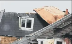  ?? Picture: Michael Wornham ?? DESTRUCTIO­N A roof ripped off apartments on Havant Road as Storm Ciara swept through the city