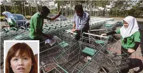  ?? PIC BY MOHD AZREN JAMALUDIN ?? Econsave supermarke­t employees sanitising trolleys in Johor Baru on Friday. (Inset) Teo Nie Ching.