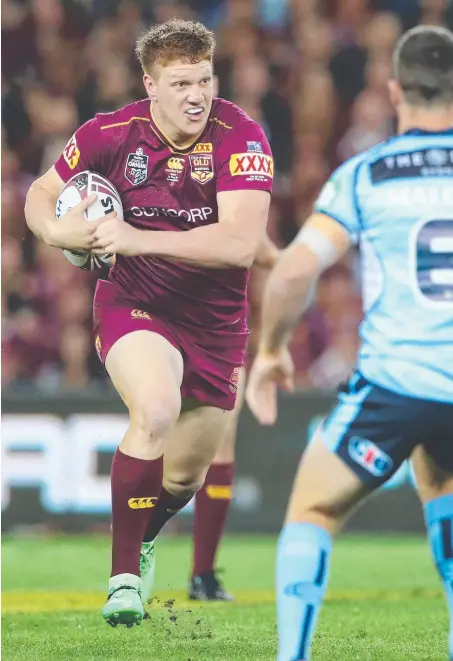  ??  ?? Maroons giant Dylan Napa makes a beeline for NSW five-eighth James Maloney last night. Picture: PETER WALLIS