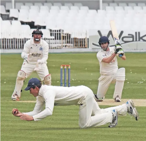  ??  ?? Scarboroug­h and Yorkshire all-rounder Ryan Gibson safely pouches a stunning one-handed catch during his side’s 10-wicket win on Monday