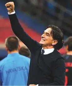  ?? AFP ?? Croatia’s coach Zlatko Dalic celebrates their third goal during the World Cup match against Argentina.