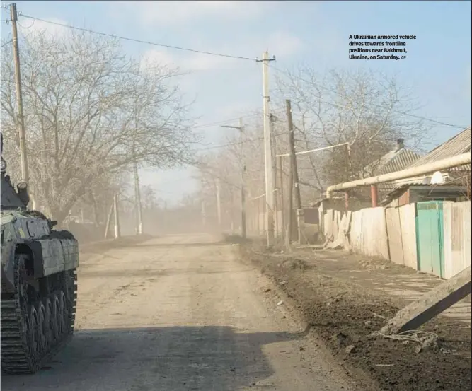  ?? AP ?? A Ukrainian armored vehicle drives towards frontline positions near Bakhmut, Ukraine, on Saturday.