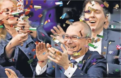  ?? MICHAEL SOHN, AP Volker Beck, a gay rights activist in the Green Party, celebrates after the German parliament’s vote Friday. ??