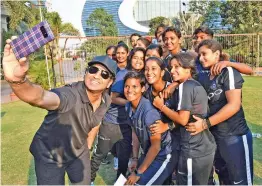  ?? — PTI ?? Sachin Tendulkar takes a selfie with the Indian women’s team in Mumbai. He gave a pep talk to the squad ahead of their South Africa tour.